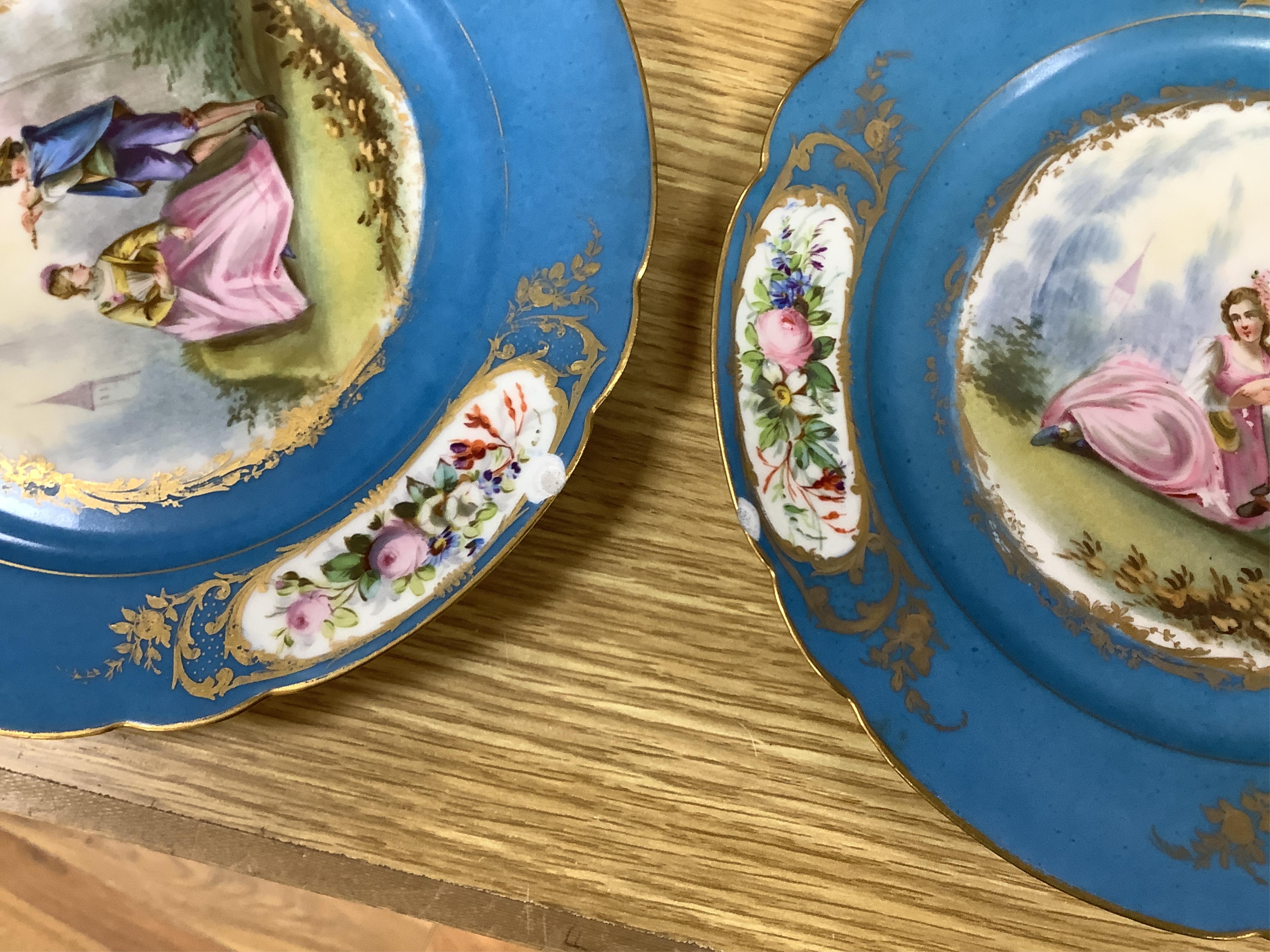 A set of eight 19th century Sevres style bleu celeste ground cabinet plates, each painted with a courting couple, 22cm diameter